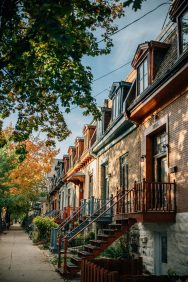 brown concrete houses near trees